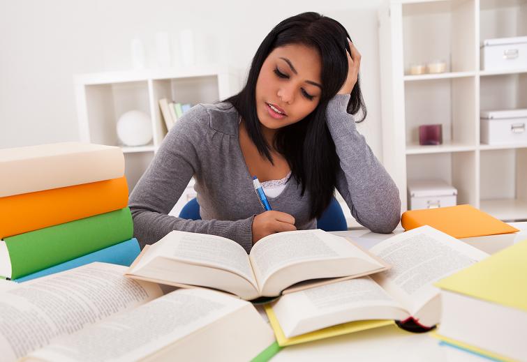 Portrait Of Young Woman Studying